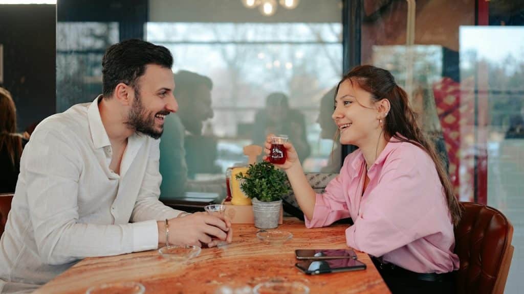 A man and a woman sitting at a table.