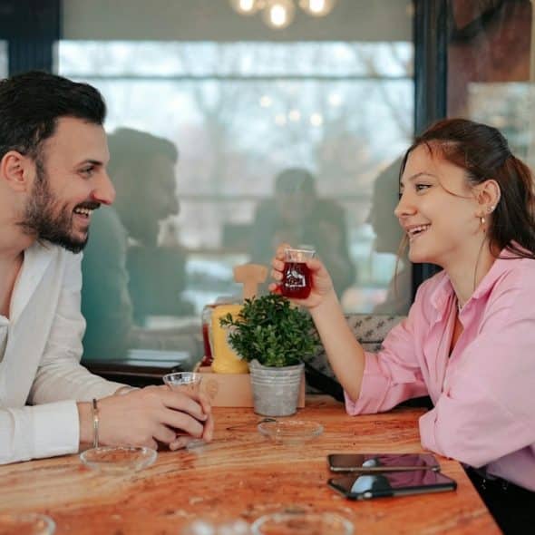A man and a woman sitting at a table.