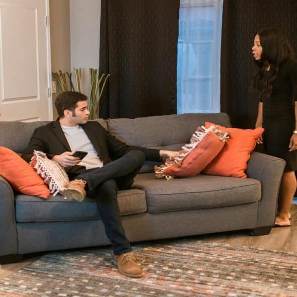 A couple fighting in the living room