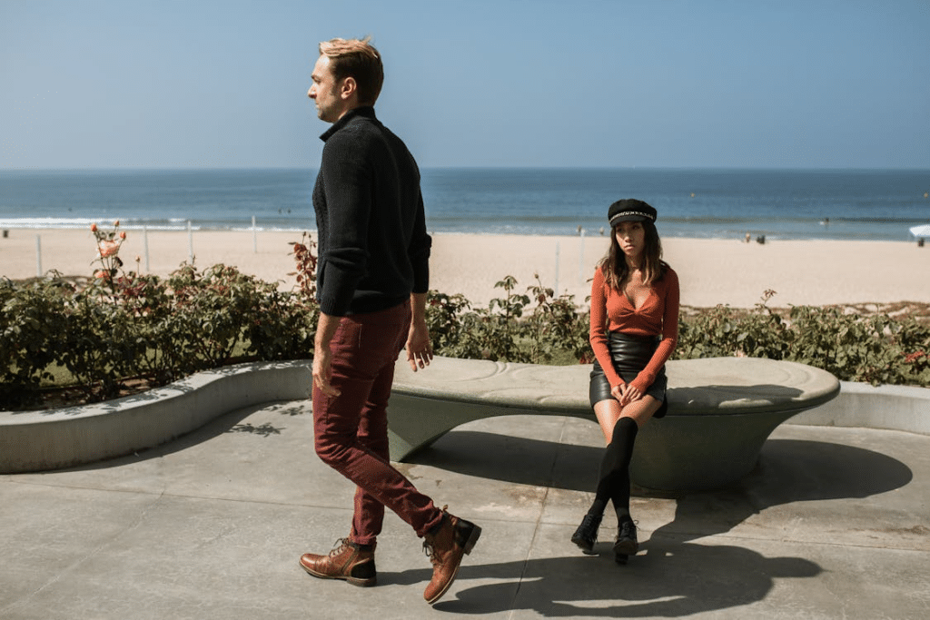 A man walking away from a  woman