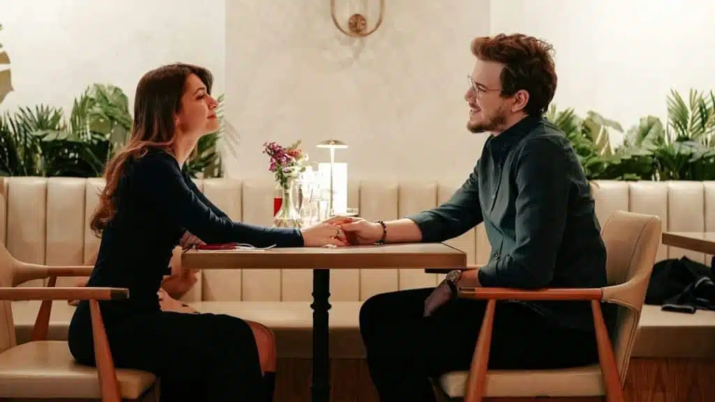 A man and a woman sitting at a table.