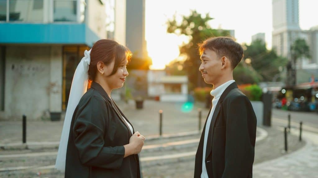 A man and a woman standing next to each other.