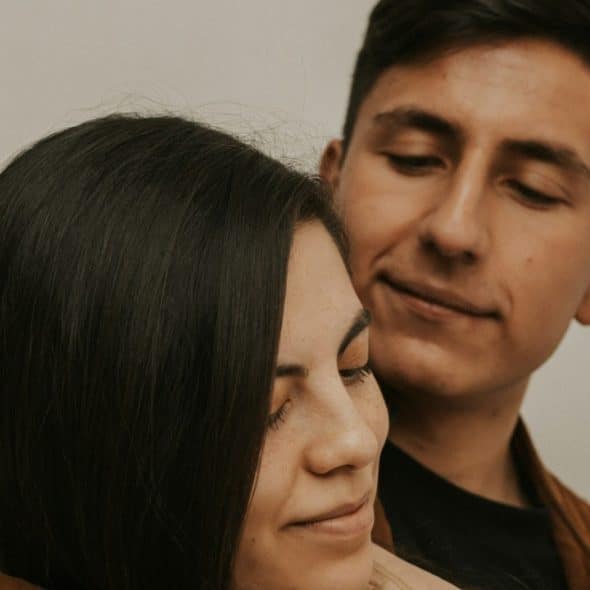 A man and a woman embracing each other.