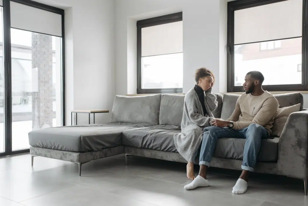 A couple sitting on a sofa