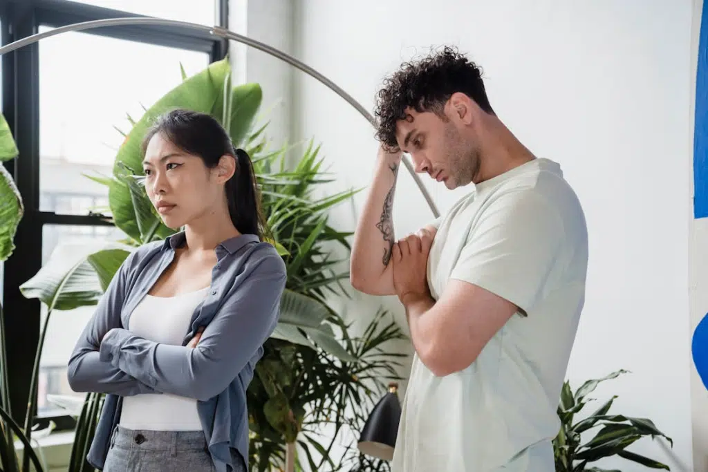 A couple arguing near the window