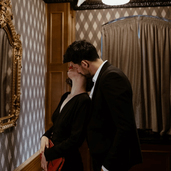 A man kissing a woman