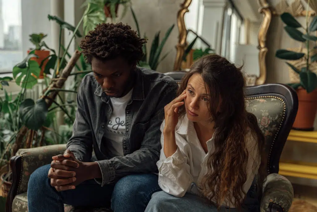 Couple sitting on a green couch