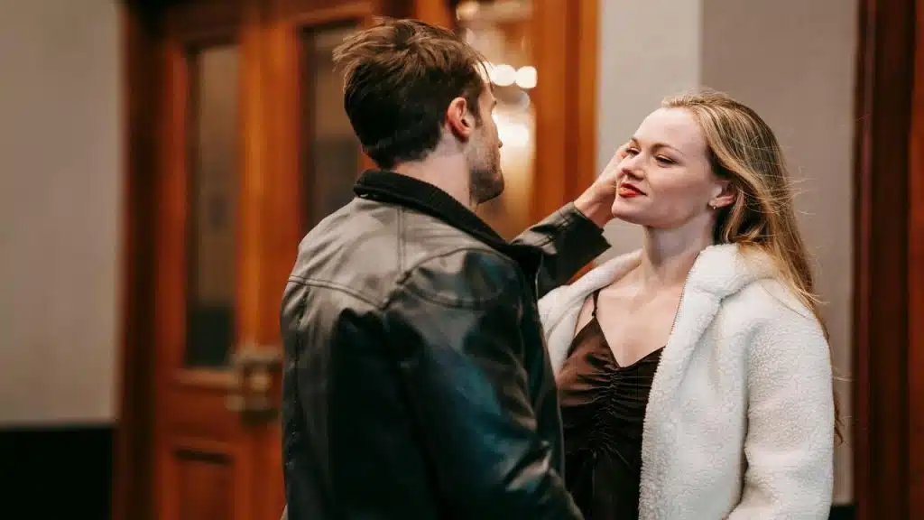 A couple saying goodbye to each other