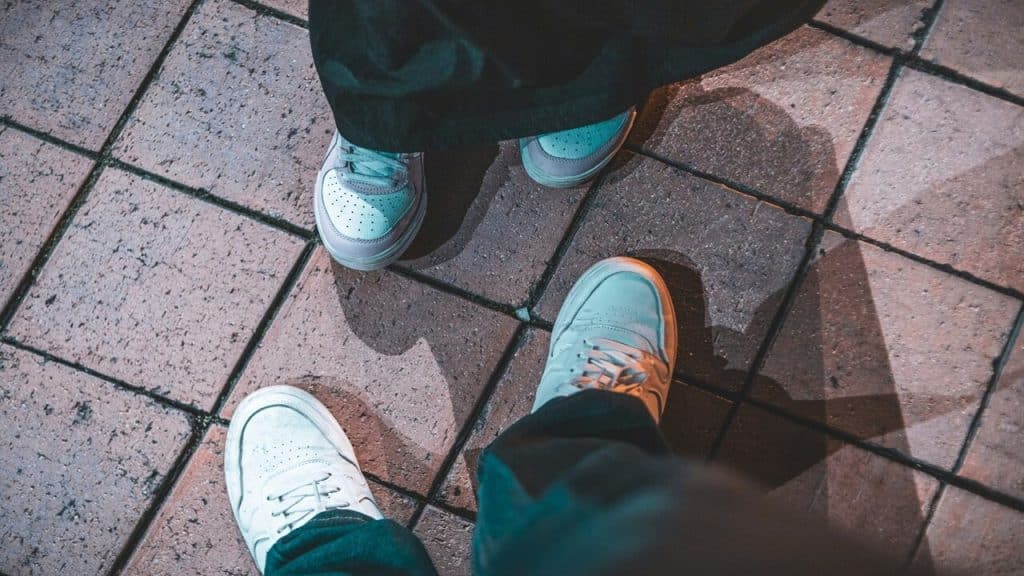 A couple with their feet pointing at each other