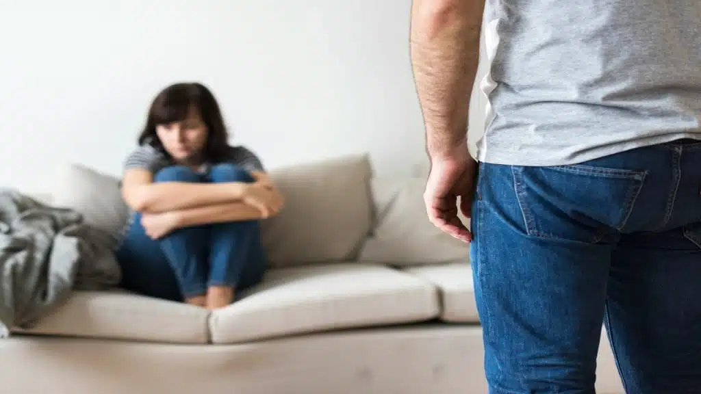 A woman looking upset at her husband