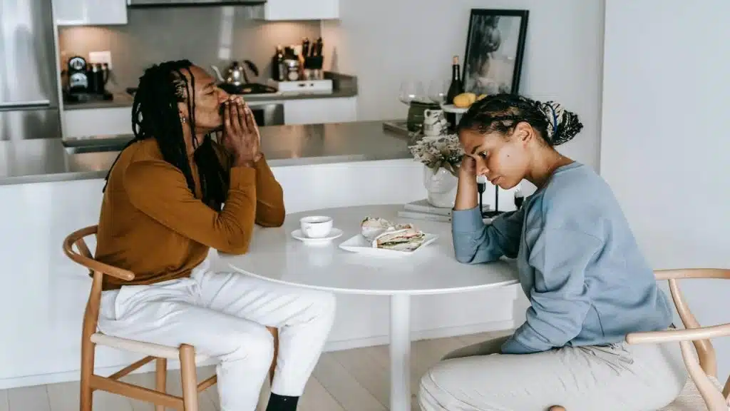 A couple having a disagreement in the kitchen