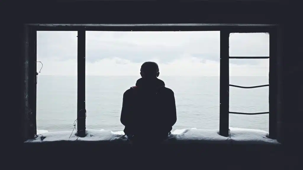 A man looking out the window