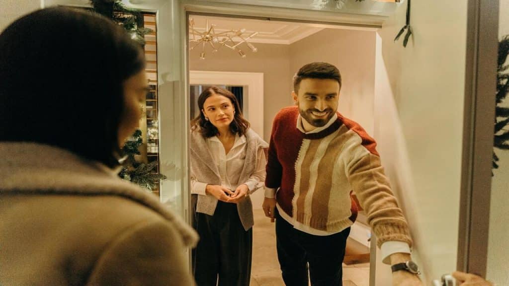A couple welcoming their guests 