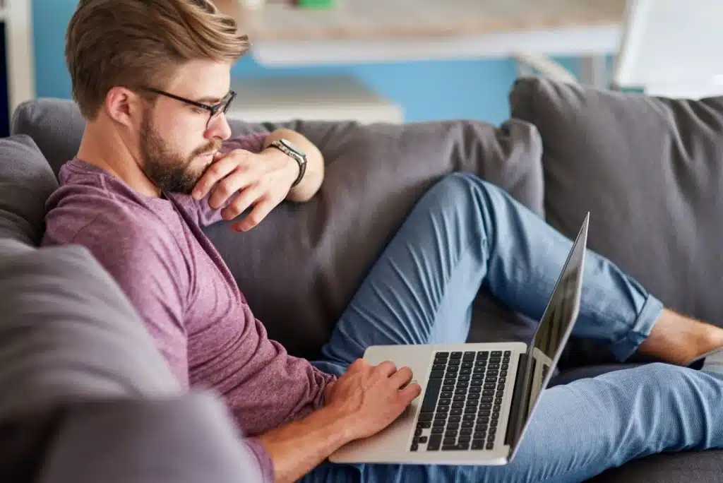 A man sitting at the sofa