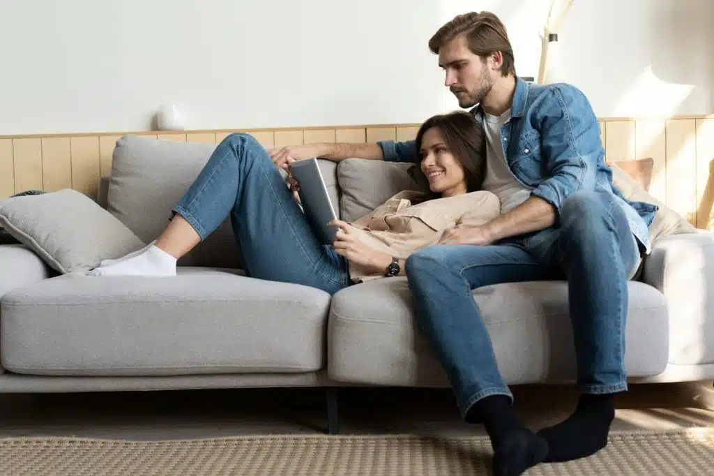 A man and woman on the couch