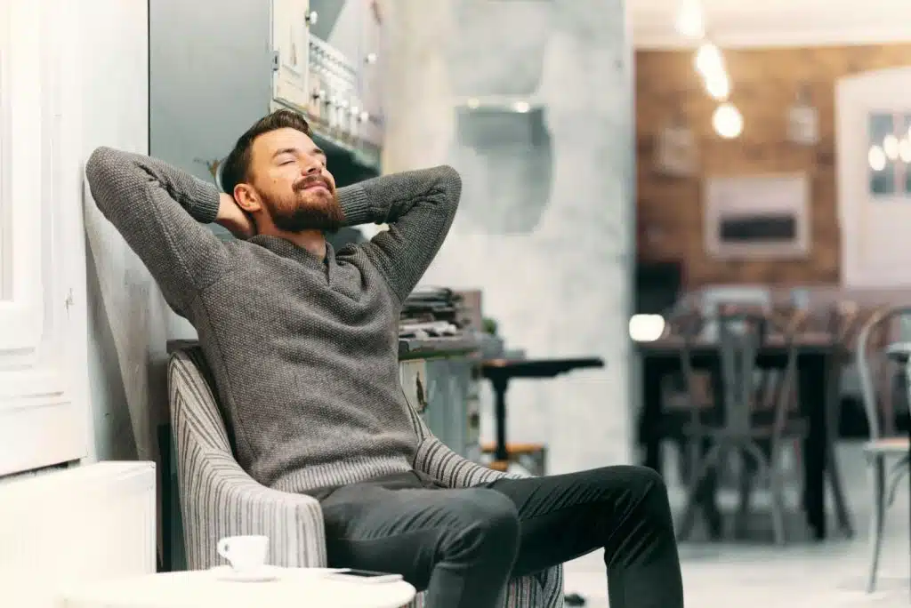 A man relaxing alone on the sofa
