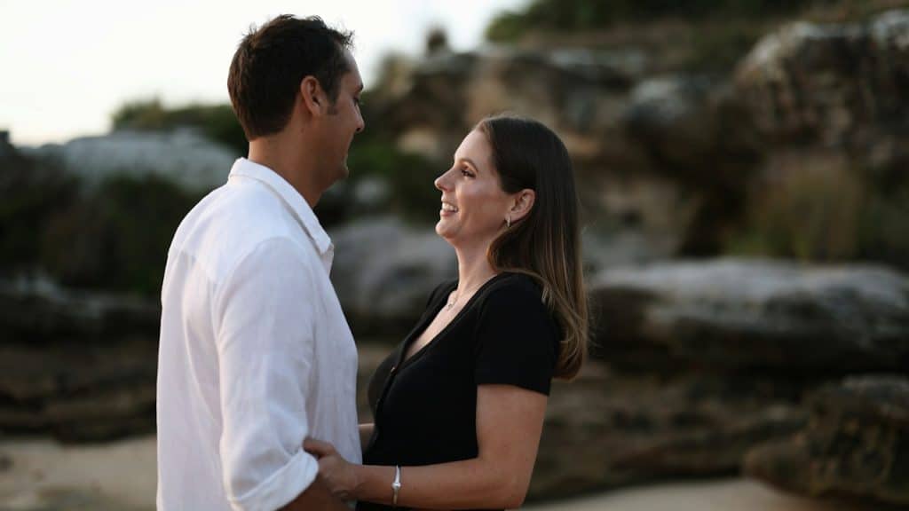 A man and a woman standing next to each other.