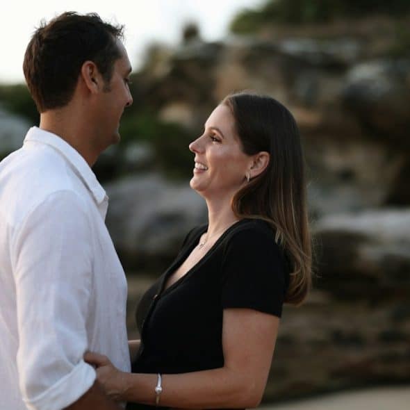 A man and a woman standing next to each other.