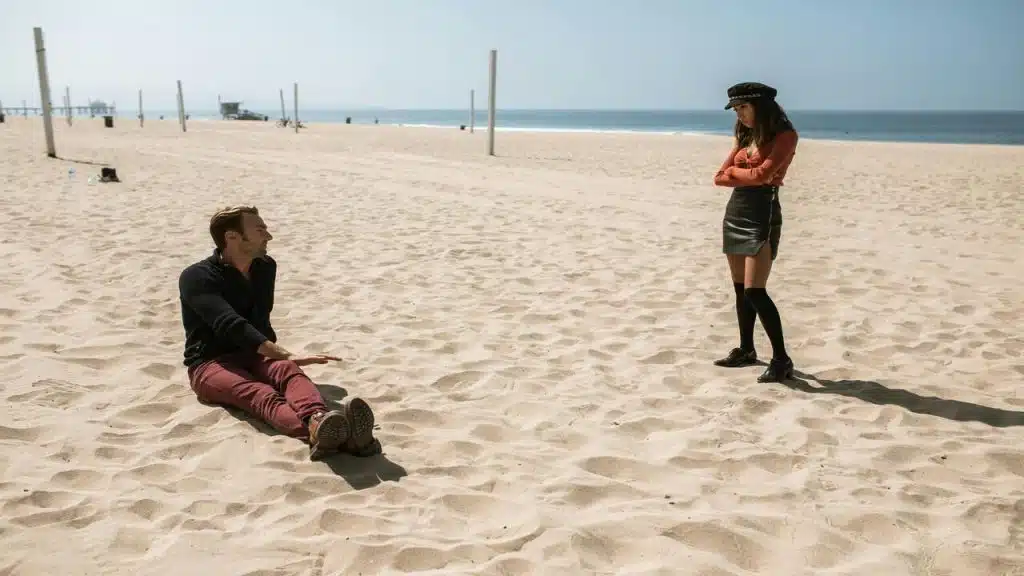 A couple talking on the beach