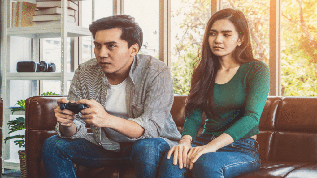 A woman upset at her husband playing video games