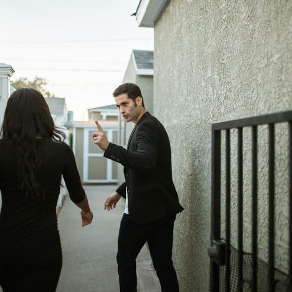 A man saying something to woman