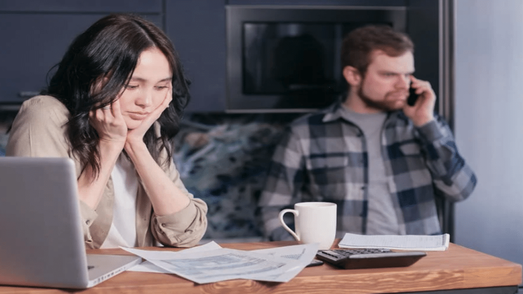 A couple busy with their bills