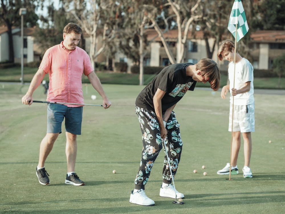 A family playing golf