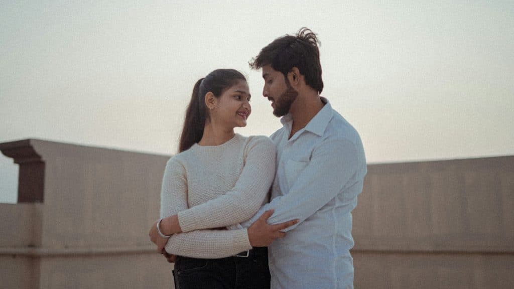 A man and a woman standing next to each other.
