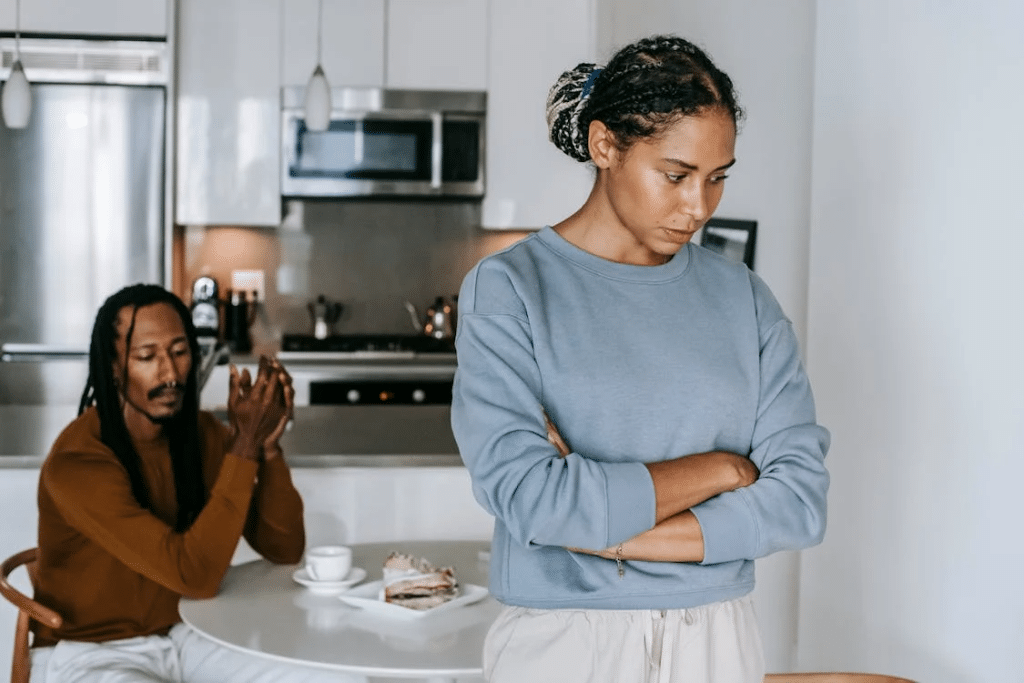 A couple arguing in the kitchen