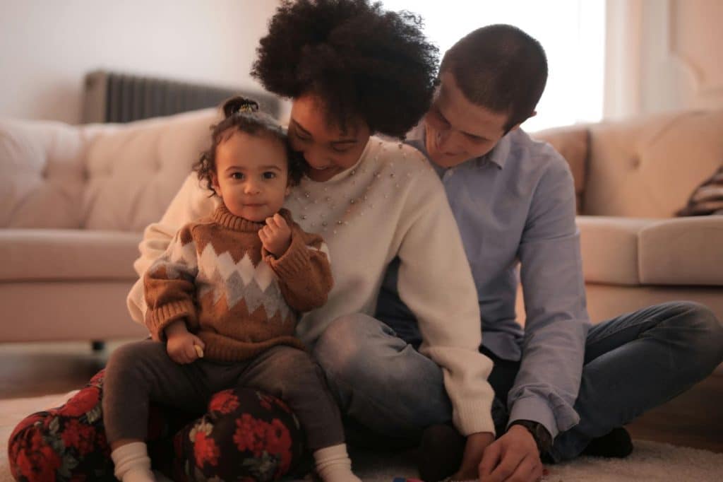A man and woman with their child