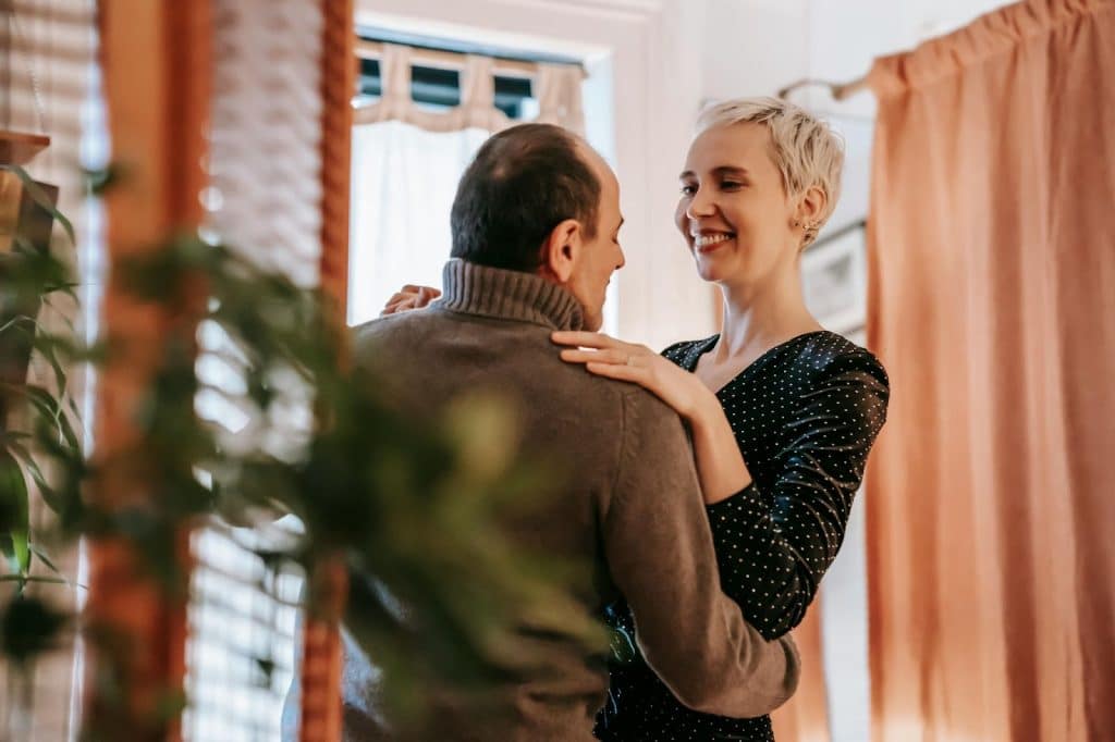 A man and woman facing each other