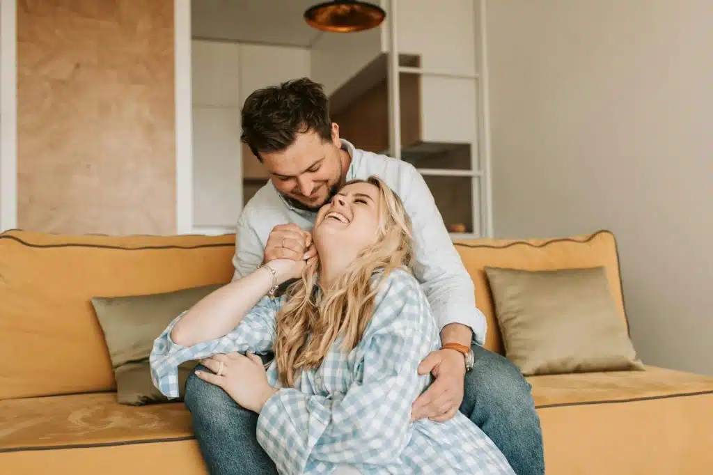A man and woman laughing together