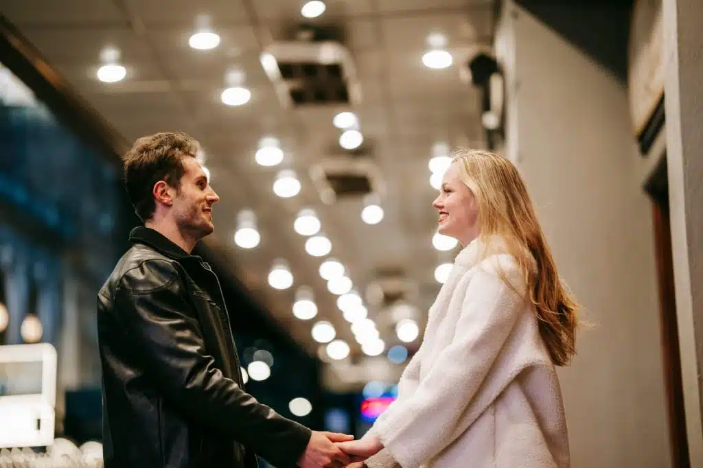 A man and woman holding hands