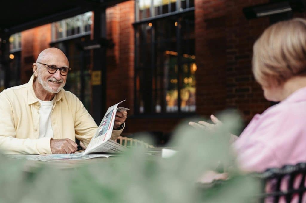 A man smiling to woman