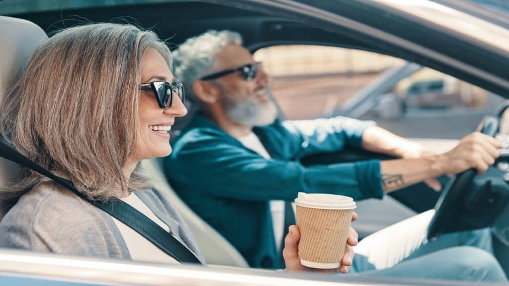 A couple driving to work together