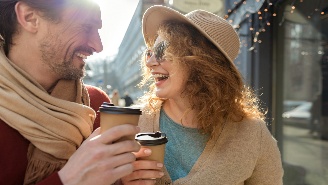 A couple having coffee outdoors