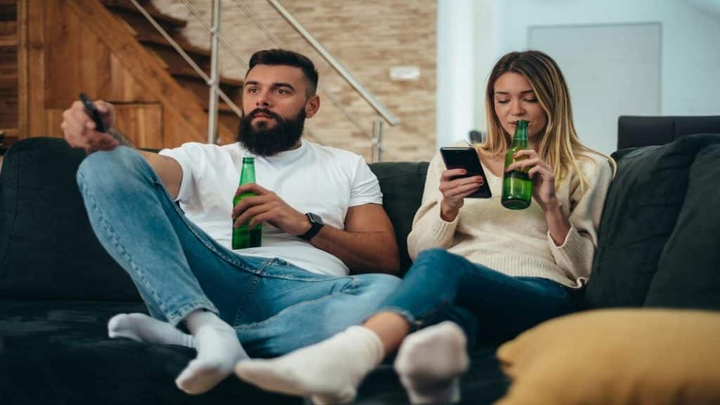 A couple watching TV at home