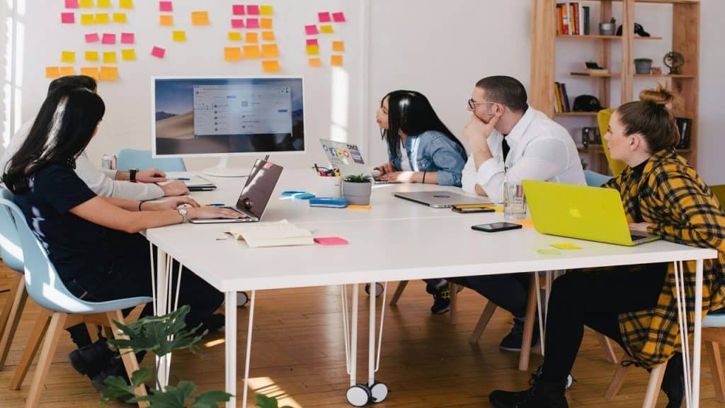 A group of people working hard in the office