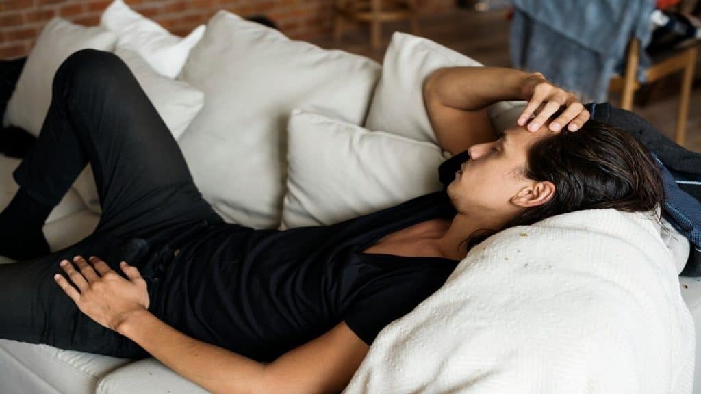 A man sleeping on the couch