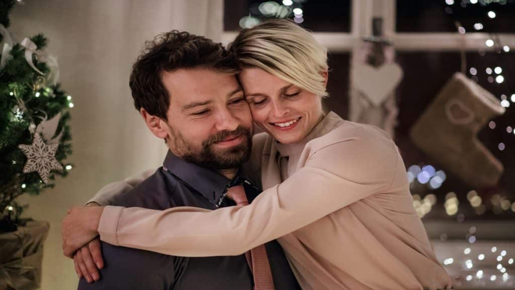 A couple hugging during Christmas