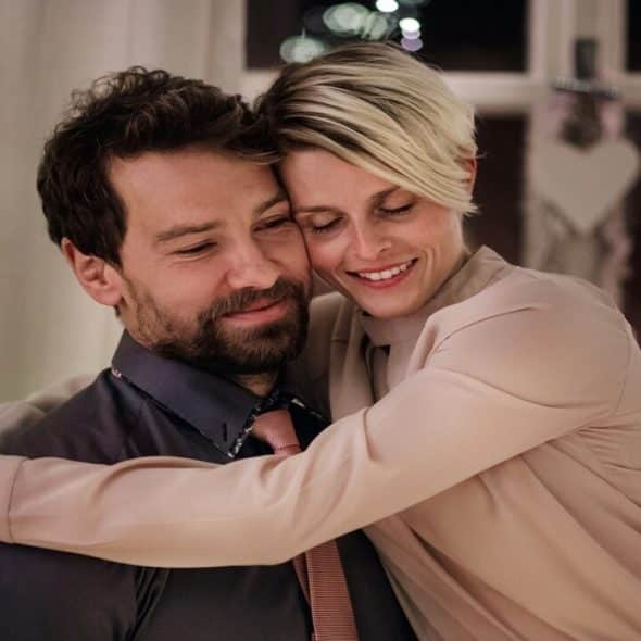 A couple hugging during Christmas