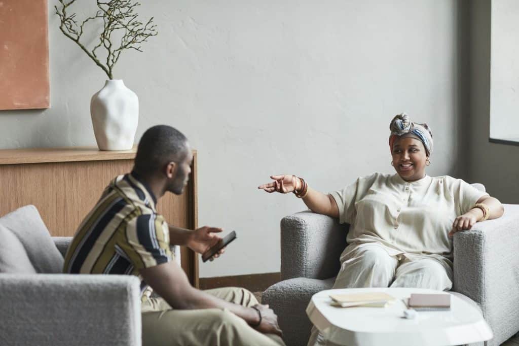 A woman trying to have a conversation with the man