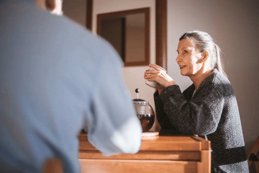 A woman holding a cup of coffee