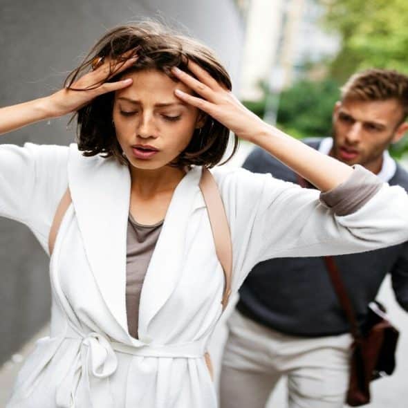 A couple arguing outdoors