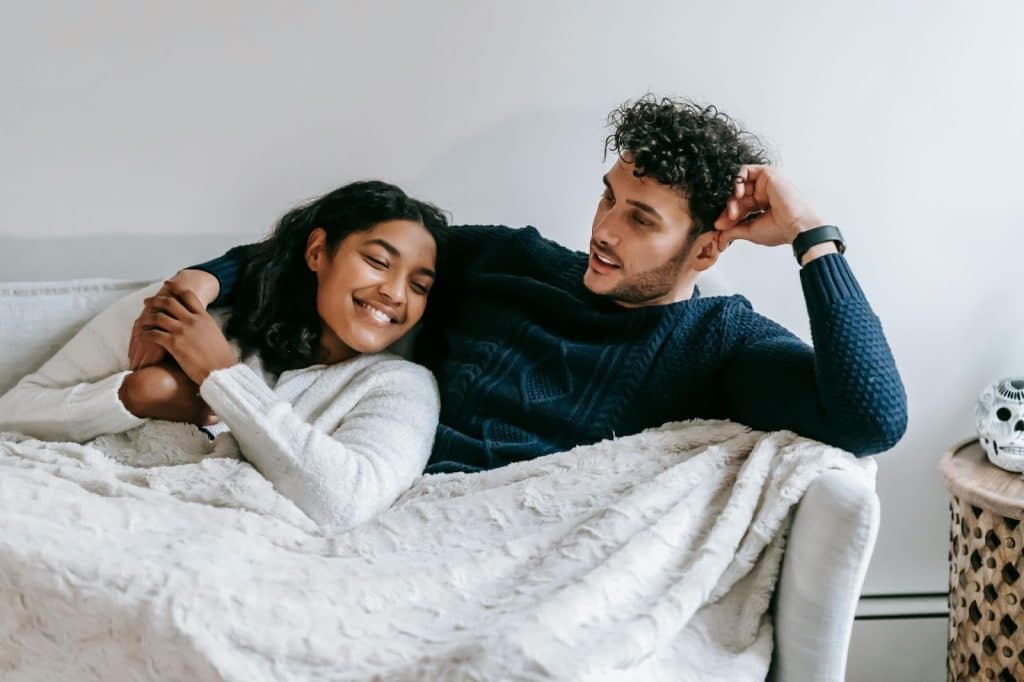 A man and woman in bed