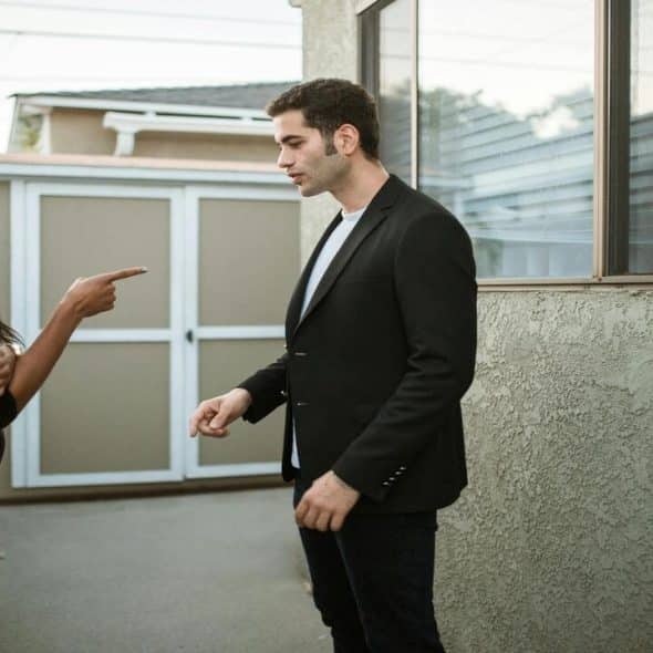 A couple arguing outdoors