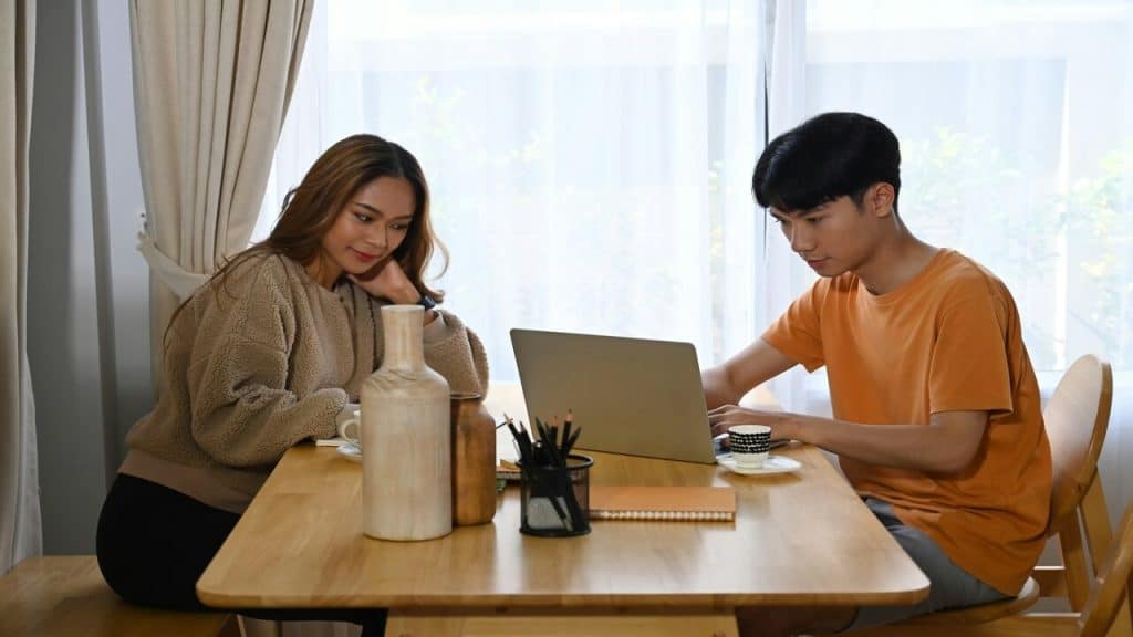 A couple busy at home