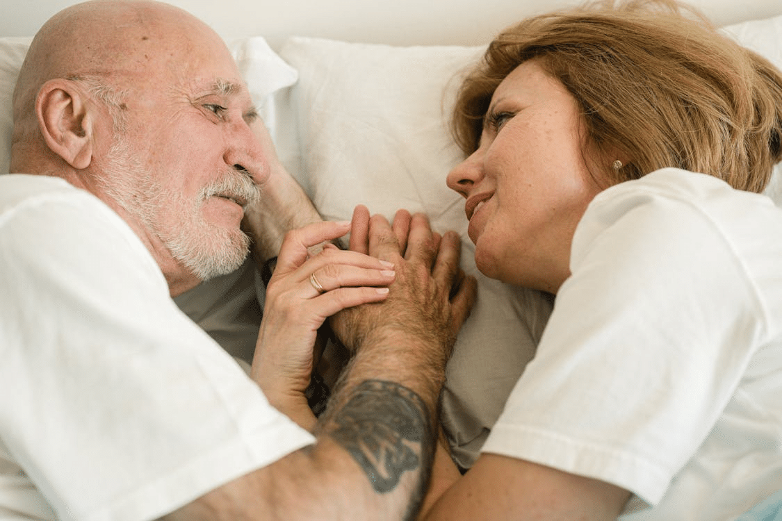 A couple lying on the bed