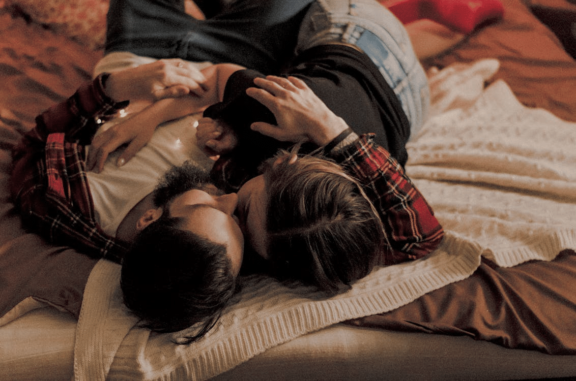 A couple lying on the bed