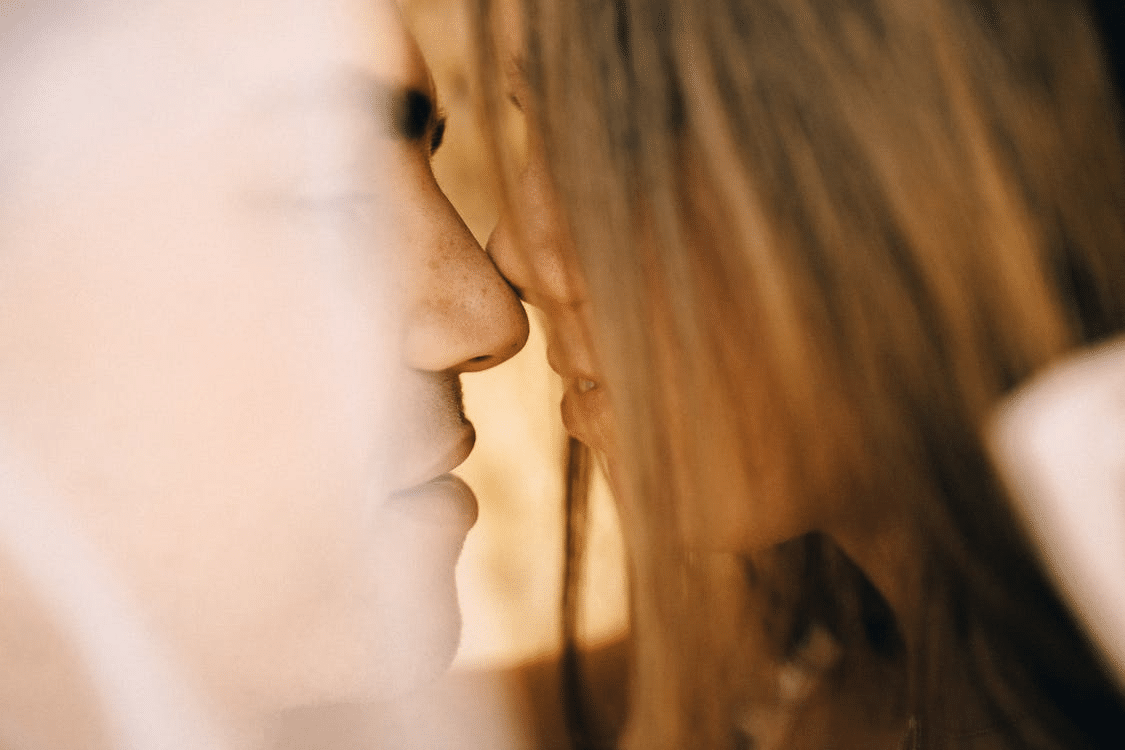 Close-up photo of a couple kissing